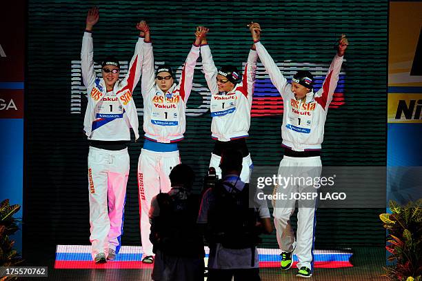 Russia's Veronika Popova, Daria Ustinova, Sveltana Chimrova and Yuliya Efimova arrive to compete in the final of the women's 4x100-metre medley relay...