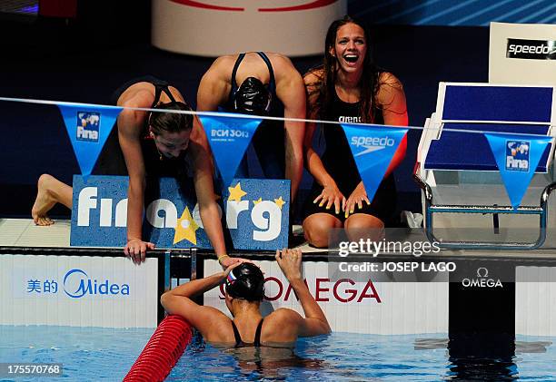 Russia's Veronika Popova, Daria Ustinova, Sveltana Chimrova and Yuliya Efimova celebrate after taking third place of the final of the women's...