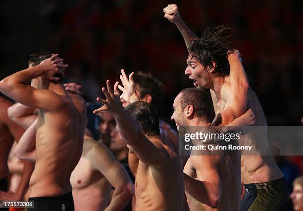 Camille Lacourt, Giacomo Perez-Dortona, Fabien Gilot and Jeremy Stravius of France celebrate after the USA are disqualified and they are instated as...