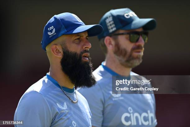 Moeen Ali of England alongside spin bowling coach Richard Dawson during nets session at Karnataka State Cricket Association Stadium on October 25,...