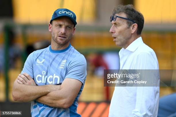 England captain Jos Buttler speaks with former captain Michael Atherton during nets session at Karnataka State Cricket Association Stadium on October...