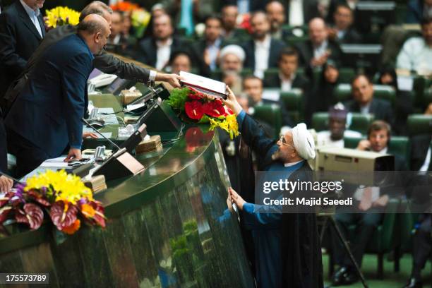 Iran's President Hassan Rowhani presents his cabinet to parliament during his swearing in ceremony, on August 4, 2013 in Tehran, Iran. As he swore...