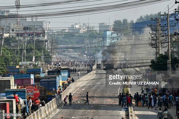 Cargo truck burns on the street after it was torched by garment workers in Shafipur on October 31 during a protest held to demand fair wages for the...