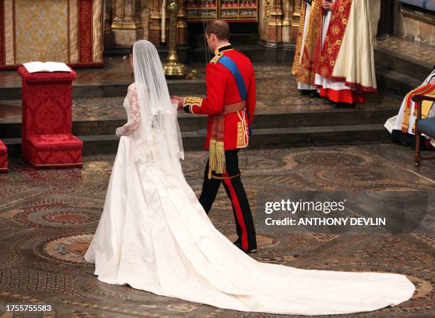 Britain's Prince William and Kate Middleton walk to the altar at Westminster Abbey in London during their Royal Wedding ceremony on April 29, 2011....