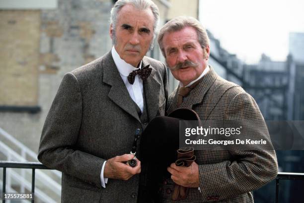 Actors Christopher Lee and Patrick Macnee pose on a shoot for the TV movie 'Sherlock Holmes and the Leading Lady' on 1991 ca. In London, England.