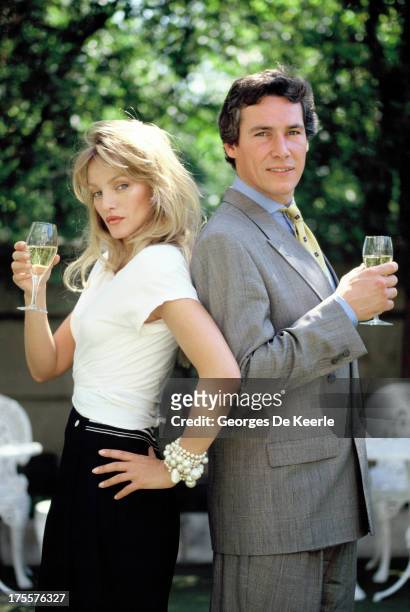 Actors Simon Dutton and Arielle Dombasle pose in a shoot for the TV movie 'The Saint' on August 1989 in London, England.