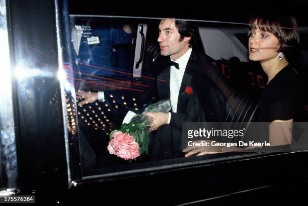 Actors Timothy Dalton and Carey Lowell arrive in their car at the premiere of the James Bond film 'License to Kill' at the Odeon cinema on June 13,...