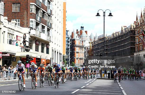 The peloton passes Harrods during the Prudential RideLondon-Surrey Classic race on August 4, 2013 in London, England.