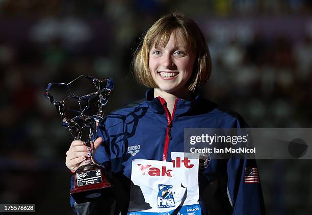 Katie Ledecky of USA with her trophy for being best swimmer of the Championships at the Palau Sant Jordi on day sixteen of the 15th FINA World...