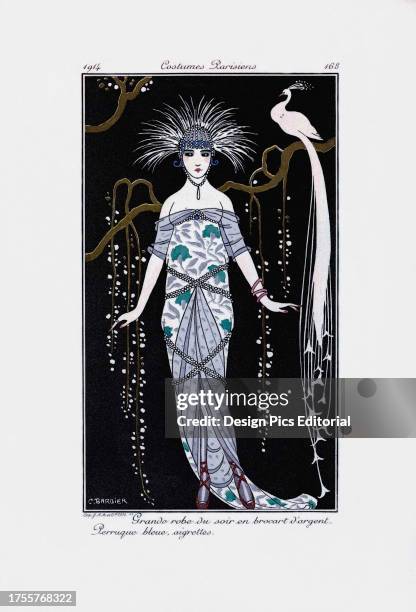 Grande robe du soir en brocart d'argent. Perruque bleue, aigrettes. Grand evening dress in silver brocade. Blue wig, crests. Print from the high...