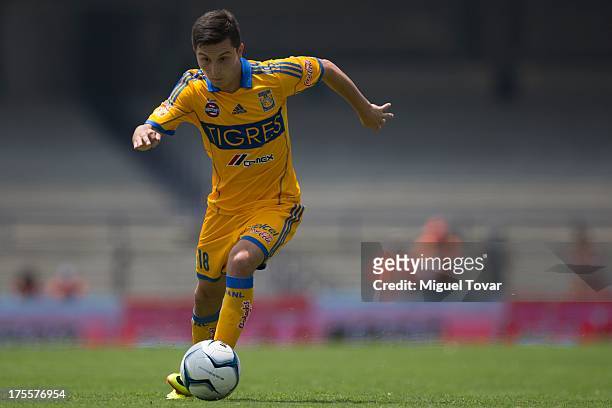 Jose Francisco Torres drives the ball during a match between Pumas and Tigres as part of the league MX at Olympic stadium, on August 04, 2013 in...