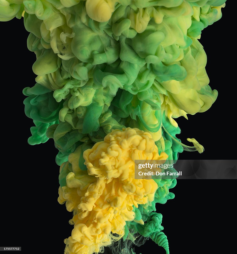 Paint under water, black background