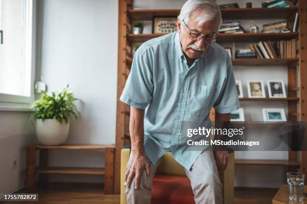 senior man having problems standing up - standing posture stock pictures, royalty-free photos & images