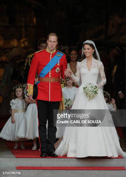 Britain's Prince William and his wife Kate, Duchess of Cambridge, come out of Westminster Abbey in London, after their wedding service, on April 29,...