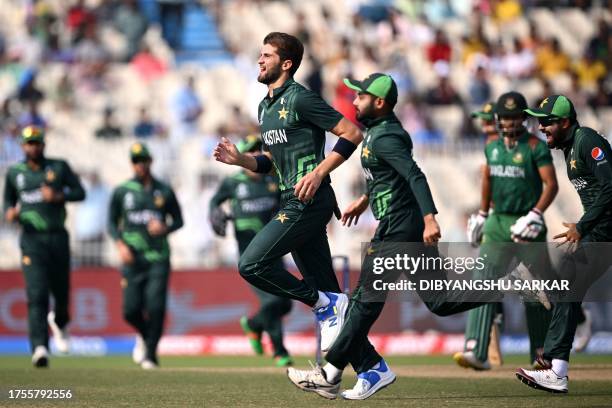 Pakistan's Shaheen Shah Afridi celebrates with teammates after taking the wicket of Bangladesh's Najmul Hossain Shanto during the 2023 ICC Men's...