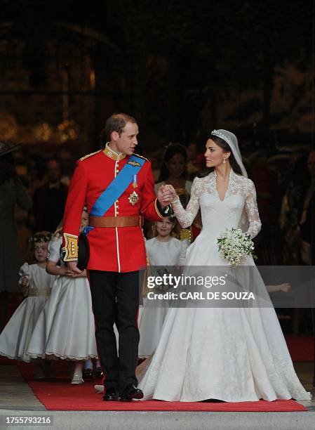 Britain's Prince William and his wife Kate, Duchess of Cambridge, come out of Westminster Abbey in London, after their wedding service, on April 29,...