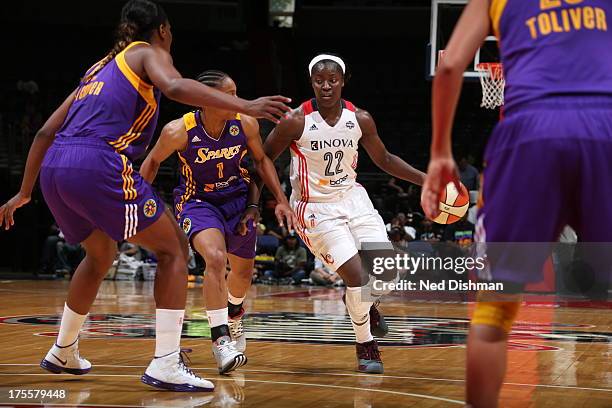 Matee Ajavon of the Washington Mystics drives against A'dia Mathies of the Los Angeles Sparks at the Verizon Center on August 4, 2013 in Washington,...