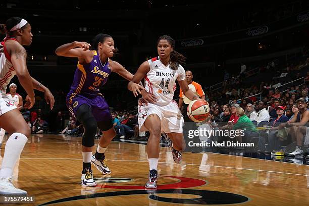 Tierra Ruffin-Pratt of the Washington Mystics drives against Marissa Coleman of the Los Angeles Sparks at the Verizon Center on August 4, 2013 in...