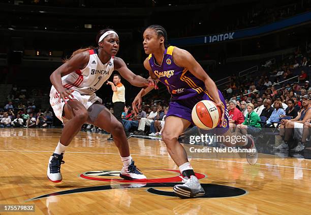 Dia Mathies of the Los Angeles Sparks drives against Crystal Langhorne of the Washington Mystics at the Verizon Center on August 4, 2013 in...