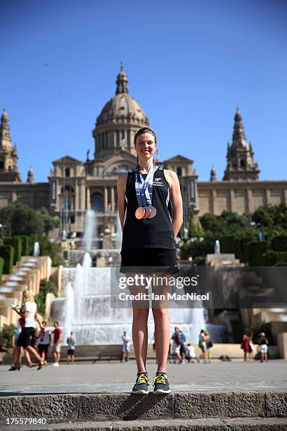 Lauren Boyle of New Zealand poses with her three Bronze medals from the 400m 800m and 1500m Freestyle, in front of The MNAC on day sixteen of the...