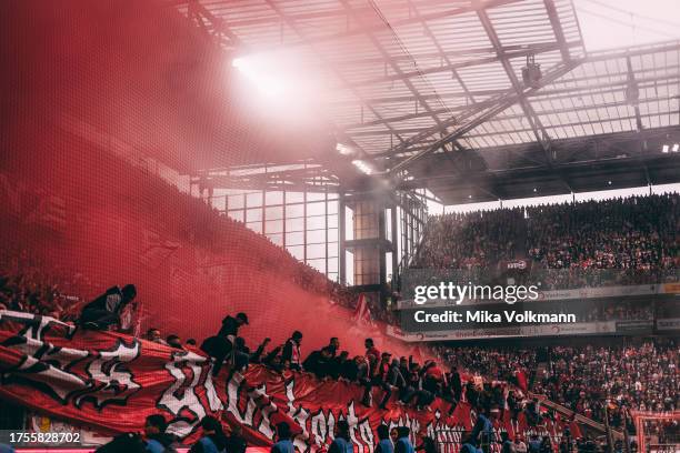 Fans fire bengal fire during the Bundesliga match between 1. FC Koeln and Borussia Moenchengladbach at RheinEnergieStadion on October 22, 2023 in...