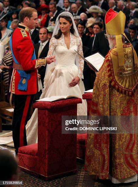 Britain's Prince William and Kate Middleton exchange vows in front of the Archbishop of Canterbury during their wedding ceremony at Westminster Abbey...