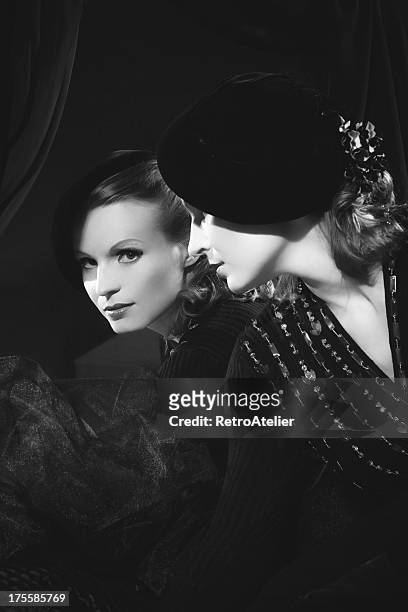 black and white photograph of woman looking in the mirror - film noir style stockfoto's en -beelden