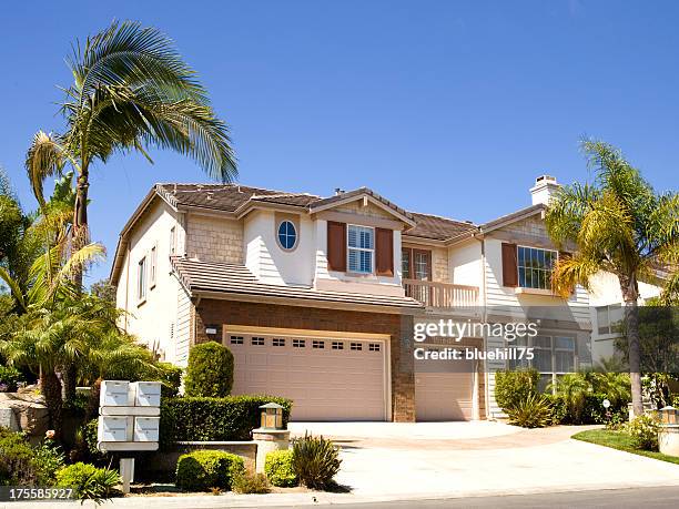 large house next to palm trees in california - huntington beach stock pictures, royalty-free photos & images