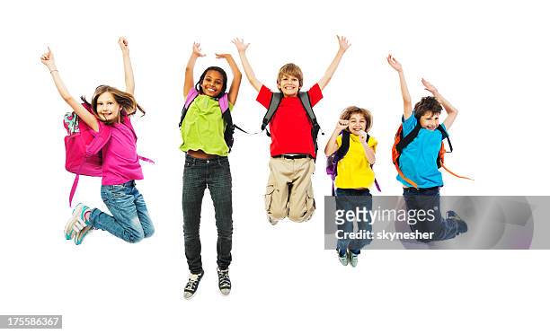 school children with backpacks jumping. - backpack isolated stock pictures, royalty-free photos & images