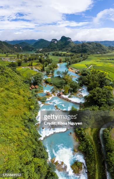aerial landscape in quay son river, trung khanh, cao bang, vietnam with nature, green rice fields and rustic indigenous houses - detian waterfall stock pictures, royalty-free photos & images