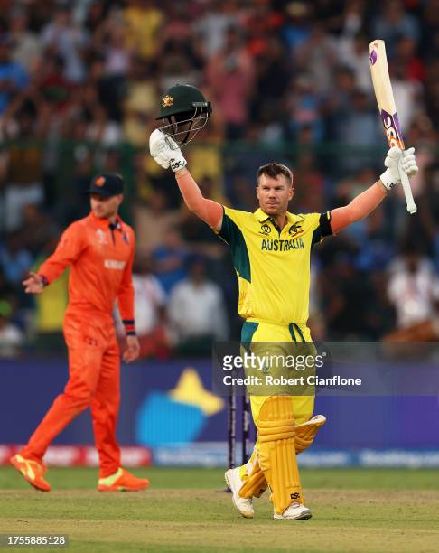 David Warner of Australia celebrates their century during the ICC Men's Cricket World Cup India 2023 between Australia and Netherlands at Arun...