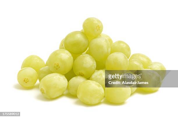 green grapes pile - green grape stock pictures, royalty-free photos & images