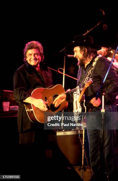 Johnny Cash with Waylon Jennings at the first Farm Aid concert, held at Memorial Stadium, Champaign, Illinois, September 25, 1985.