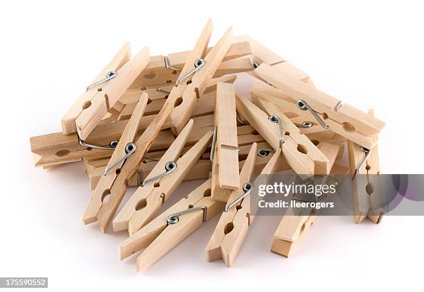 heap of wooden clothes pegs - clothes peg isolated stock pictures, royalty-free photos & images