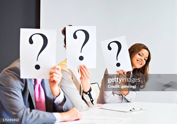 executives covering their faces with a question mark - classified ad stock pictures, royalty-free photos & images