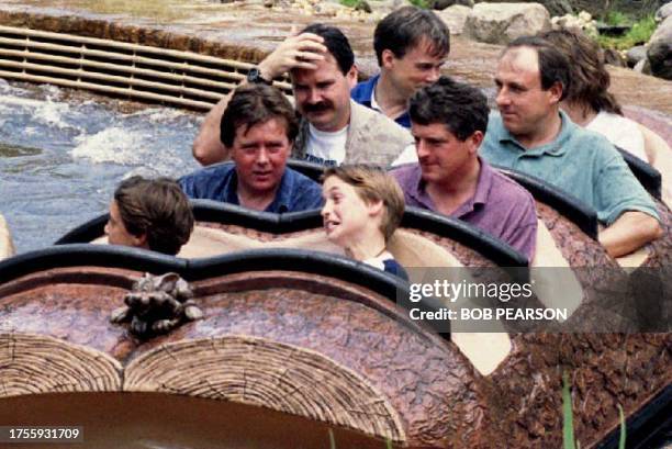 Prince William of Wales grimaces after he and friends of the royal family finished their ride 26 August 1993 on Splash Mountain at Disney World's...