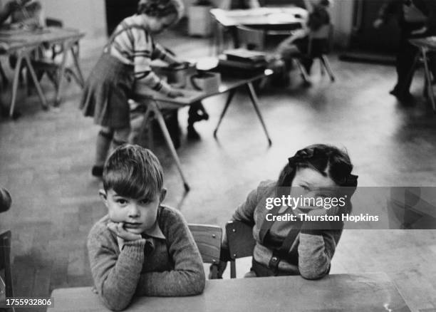 Marcus Howell and Gillian Cook, both children of employees at the Atomic Energy Research Establishment at an AERE school in Abingdon-on-Thames,...