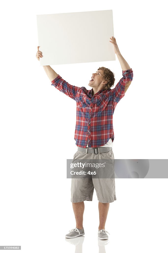 Man holding up a placard