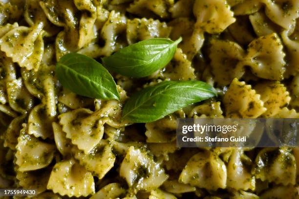 In this photo illustration, a dish of farfalle pasta with pesto on World Pasta Day on October 25, 2023 in Turin, Italy. The versatile food and...