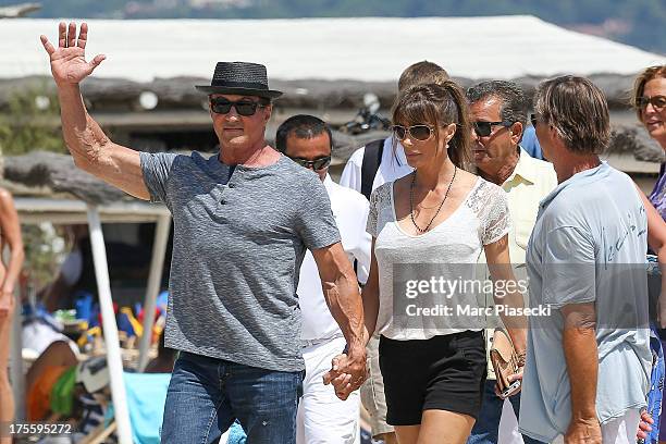 Sylvester Stallone and wife Jennifer Flavin are seen arriving at the 'Club 55' beach on August 4, 2013 in Saint-Tropez, France.