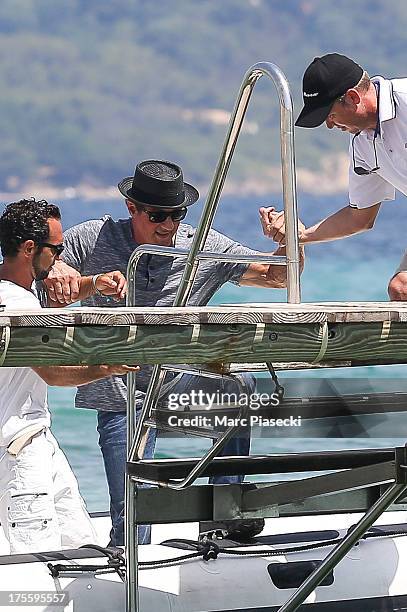 Sylvester Stallone is seen arriving at the 'Club 55' beach on August 4, 2013 in Saint-Tropez, France.