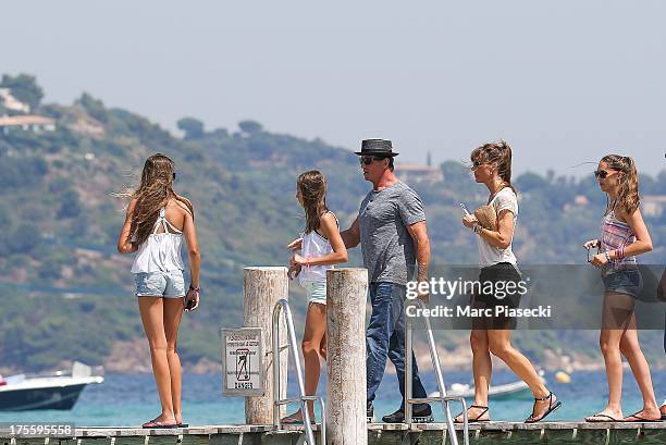 Sylvester Stallone and wife Jennifer Flavin are seen arriving at the 'Club 55' beach on August 4, 2013 in Saint-Tropez, France.