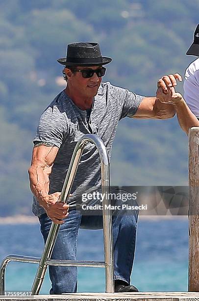 Sylvester Stallone is seen arriving at the 'Club 55' beach on August 4, 2013 in Saint-Tropez, France.