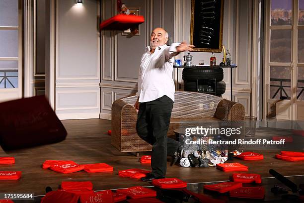 Actor Gerard Jugnot during the traditional throw of cushions at the final curtain call of "Cher Tresor" on day 5 of the 29th Ramatuelle Festival on...