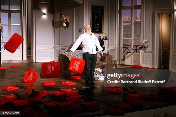 Actor Gerard Jugnot during the traditional throw of cushions at the final curtain call of "Cher Tresor" on day 5 of the 29th Ramatuelle Festival on...