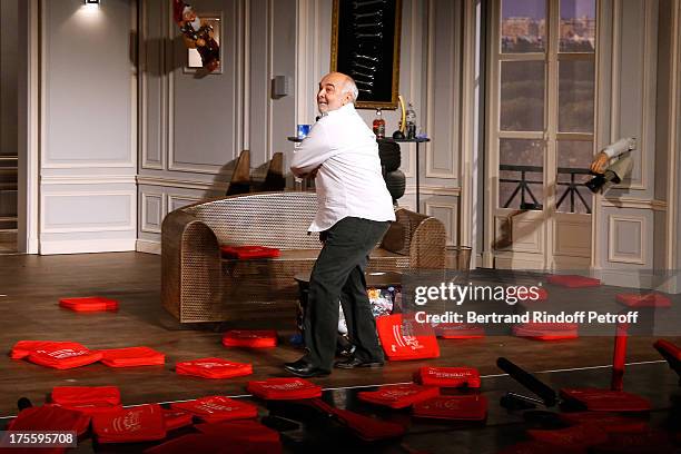 Actor Gerard Jugnot during the traditional throw of cushions at the final curtain call of "Cher Tresor" on day 5 of the 29th Ramatuelle Festival on...