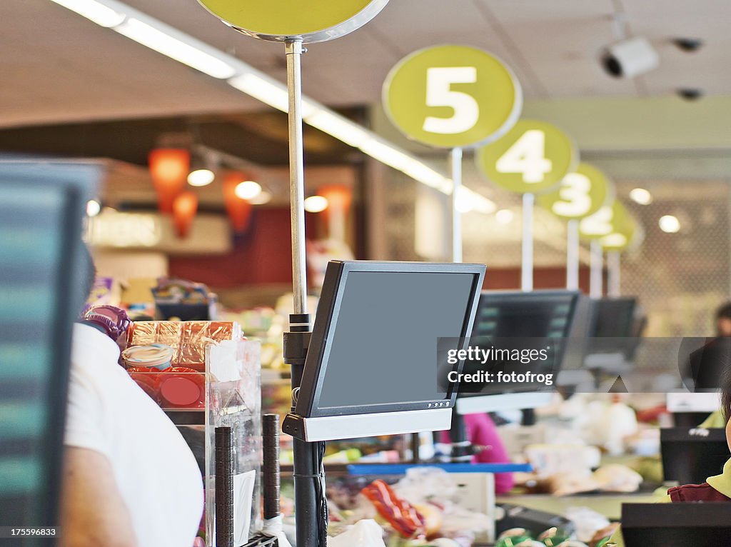 Rows of cashier checkout lanes at a store