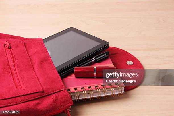 digital tablet in  woman's bag backpack - purse contents stock pictures, royalty-free photos & images