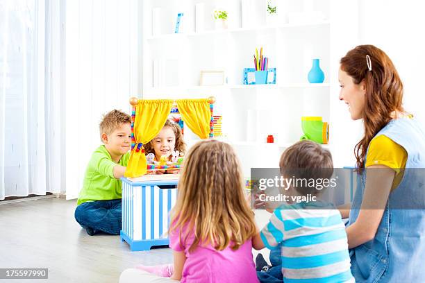 children playing finger puppet show. - puppet show stock pictures, royalty-free photos & images