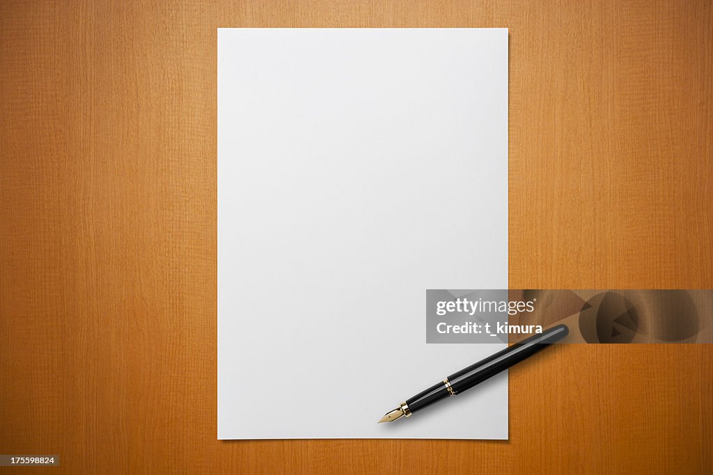 Blank paper on Desk with a pen